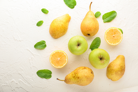 Summer composition with ripe fruits on white textured backgroundの写真素材
