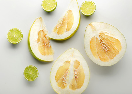 Summer composition with tropical fruits on white background