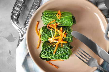 Plate with stuffed cabbage leaves on tableの写真素材