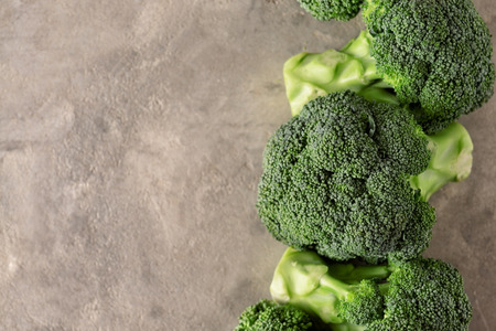 Fresh broccoli on grey backgroundの写真素材