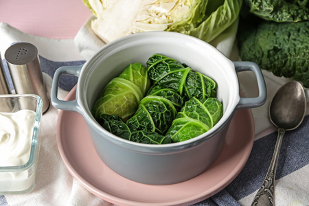 Casserole with stuffed cabbage leaves on tableの写真素材