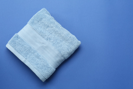 Clean soft towel on color background