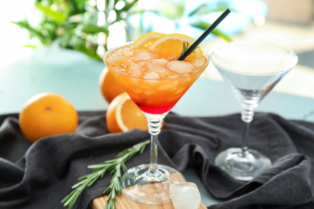 Glass with delicious summer cocktail on tableの写真素材