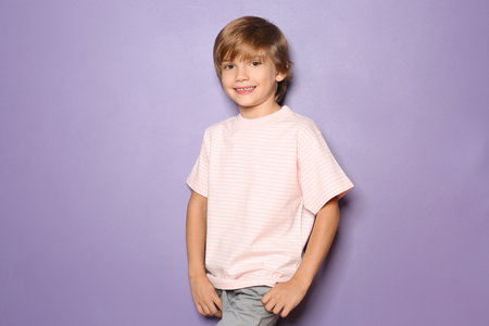 Little boy in t-shirt on color backgroundの写真素材