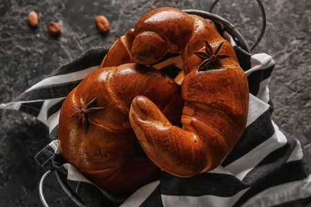 Basket with tasty fresh crescent rolls on table, closeupの写真素材