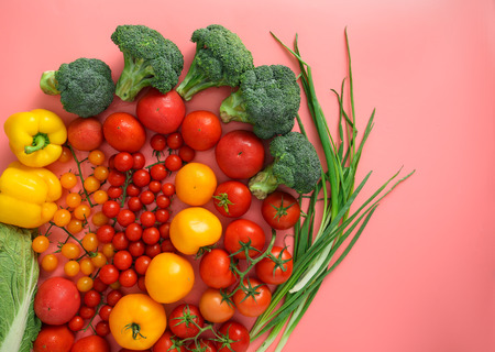 Composition with different vegetables on color backgroundの写真素材