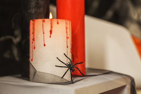 Burning candles as decor for Halloween party on standの写真素材
