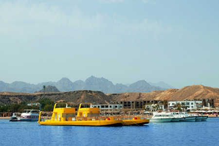 Modern boats near tropical resort on sunny dayの写真素材