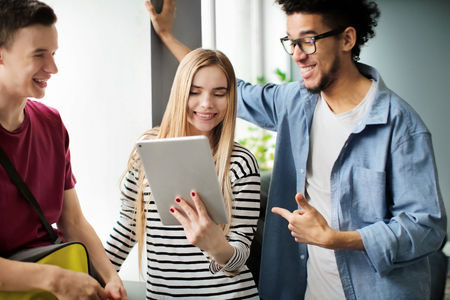 Students resting together in campus buildingの写真素材