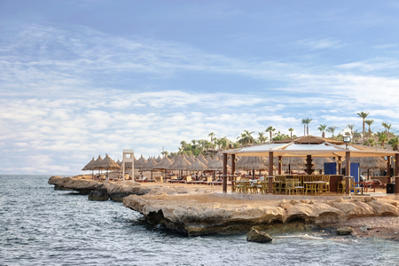 Beautiful view of hotel territory with beach cafe at tropical resortの写真素材