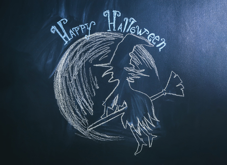 Drawing of witch with text "Happy Halloween" on dark backgroundの写真素材