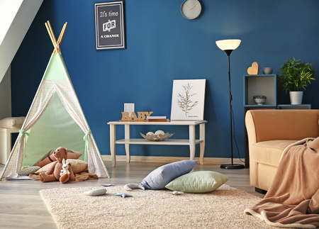 Cozy play tent for kids in interior of roomの写真素材