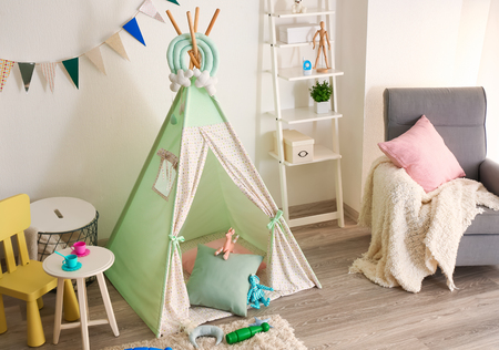 Cozy play tent for kids in interior of roomの写真素材