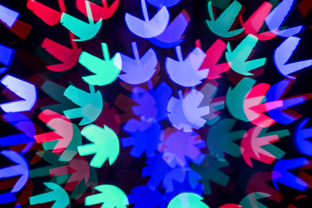 Blurred view of beautiful lights on dark backgroundの写真素材