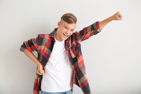 Emotional teenage boy on white backgroundの写真素材