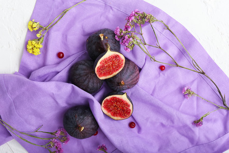 Fresh ripe figs on color napkinの写真素材