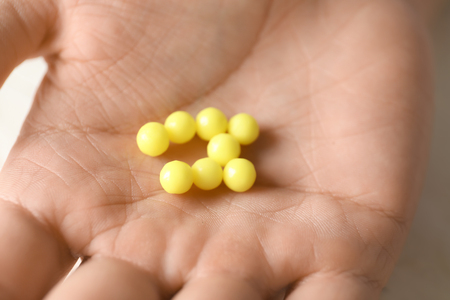 Pills om male hand, closeupの写真素材