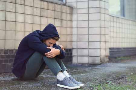 Stressed young man outdoorsの写真素材