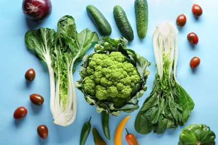 Various fresh vegetables on color backgroundの写真素材