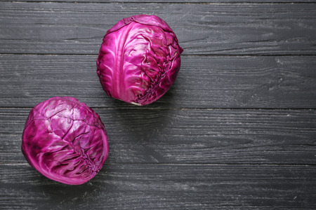 Fresh red cabbages on wooden tableの写真素材