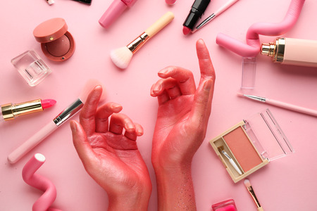 Woman with decorative cosmetics on color backgroundの写真素材