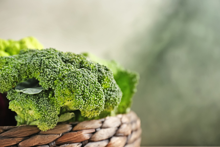 Wicker basket with fresh broccoli, closeupの写真素材