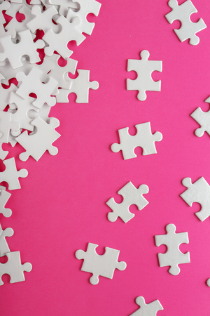 Pieces of jigsaw puzzle on color backgroundの写真素材