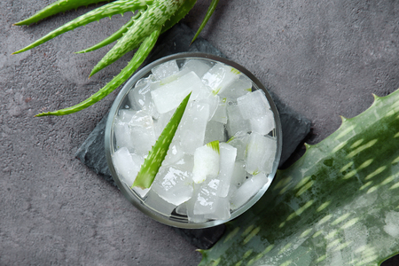 Plate with peeled aloe vera on table, top viewの写真素材