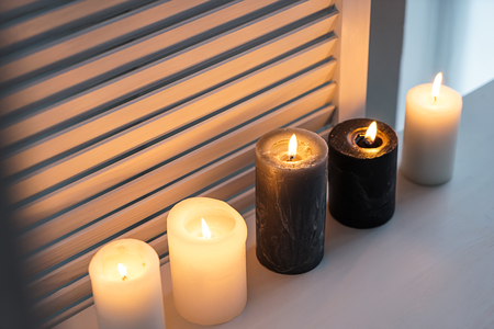 Beautiful burning candles on windowsillの写真素材