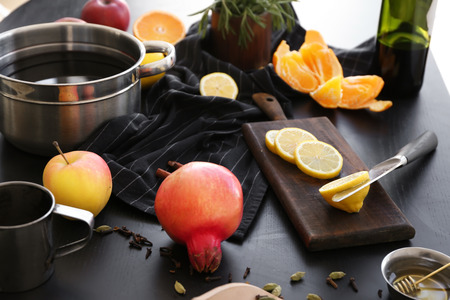 Ingredients for mulled wine on dark tableの写真素材