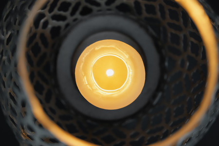 Burning candle in decorative holder, closeupの写真素材