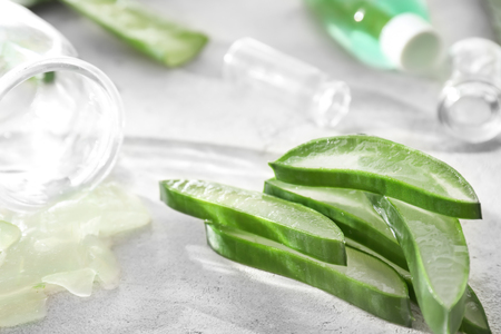 Fresh sliced aloe vera leaves on light tableの写真素材
