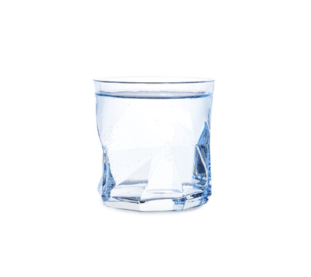 Glass of cold fresh water on white backgroundの写真素材