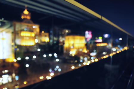Blurred view of illuminated city at nightの写真素材