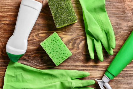 Cleaning supplies on wooden backgroundの写真素材