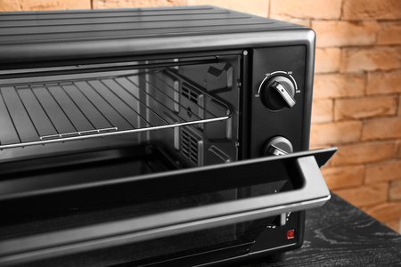 Modern electric oven on dark table, closeupの写真素材