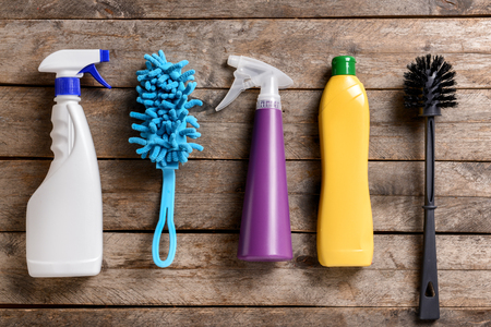 Cleaning supplies on wooden backgroundの写真素材