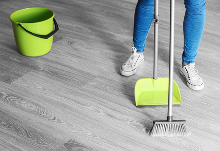 Woman cleaning floor at home