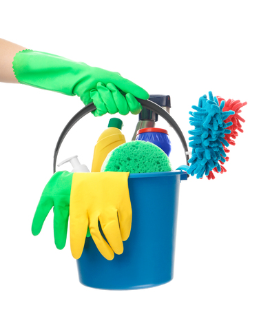 Woman holding bucket with cleaning supplies on white backgroundの写真素材