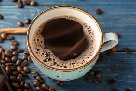 Cup of hot coffee on wooden tableの写真素材
