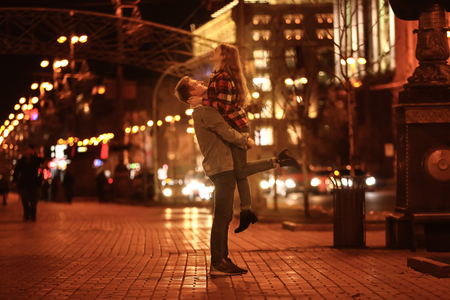 Loving young couple on romantic date in eveningの写真素材