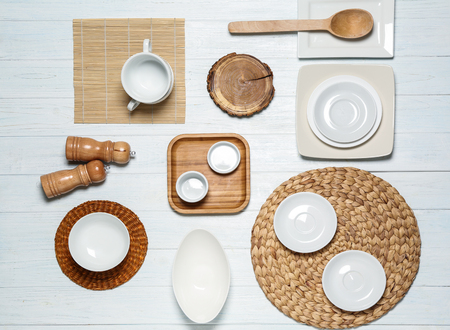Set of clean tableware on white wooden backgroundの写真素材