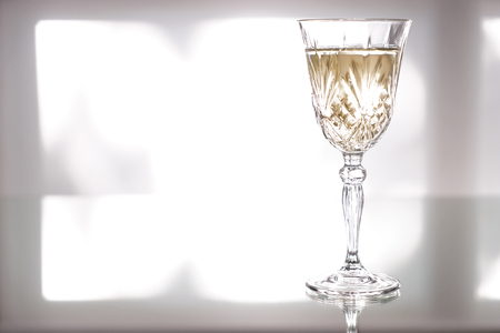 Glass of tasty wine on tableの写真素材