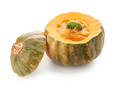 Tasty cream soup served in pumpkin on white backgroundの写真素材