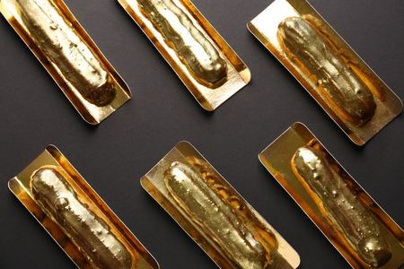 Delicious eclairs on grey background, top viewの写真素材