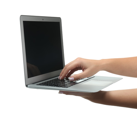 Female hands with laptop on white backgroundの写真素材
