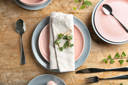 Festive table setting on wooden backgroundの写真素材