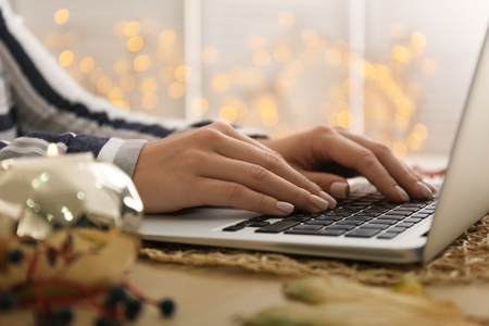 Woman using laptop on table, closeupの写真素材