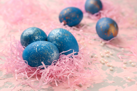 Nest with Easter eggs on color backgroundの写真素材