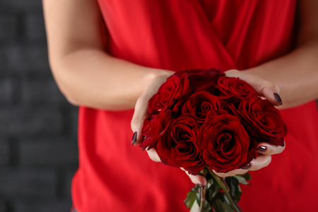 Woman with bouquet of beautiful roses, closeupの写真素材